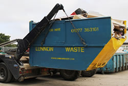 Skip Hire Ongar full skip being unloaded